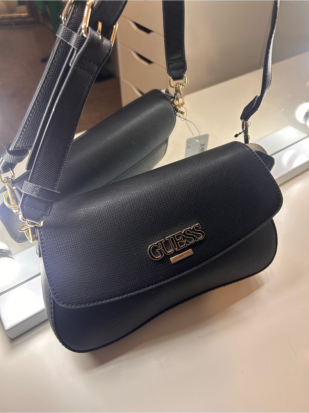 GUESS Black Crossbody Saddle Bag with Gold Logo Plaque